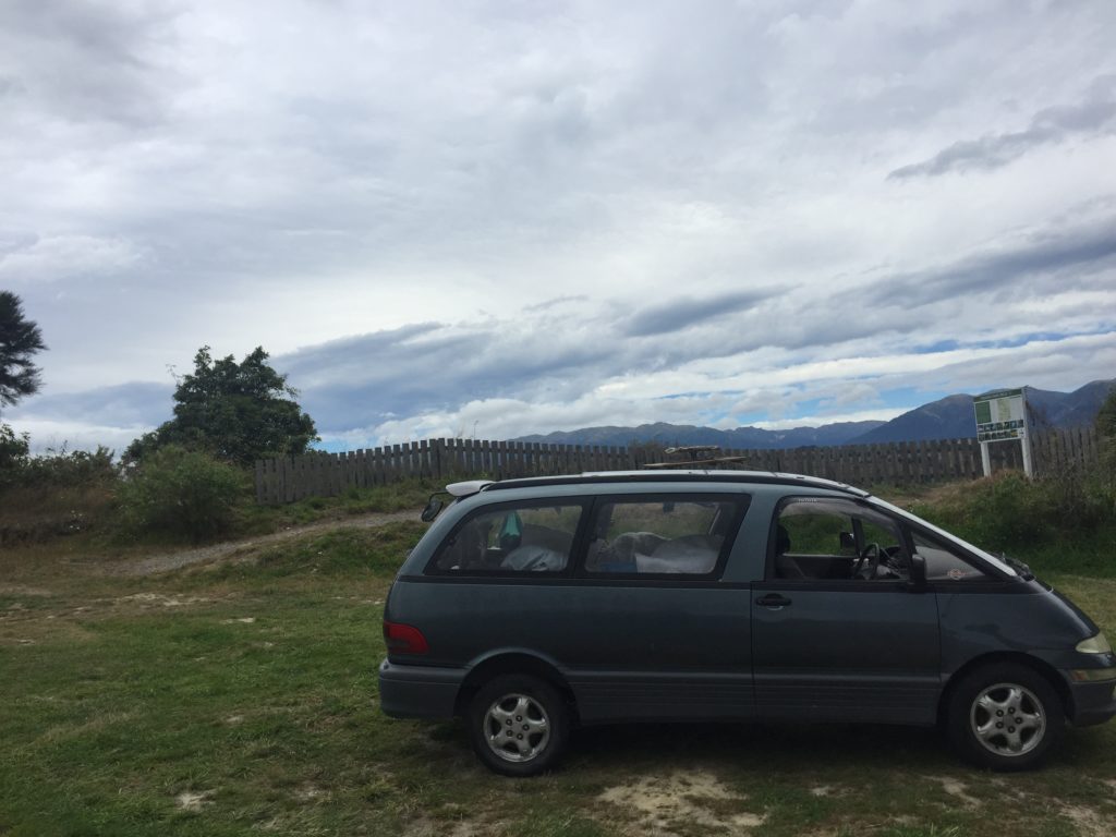 A 1992 Toyota Estima with camping gear for a road trip through New Zealand